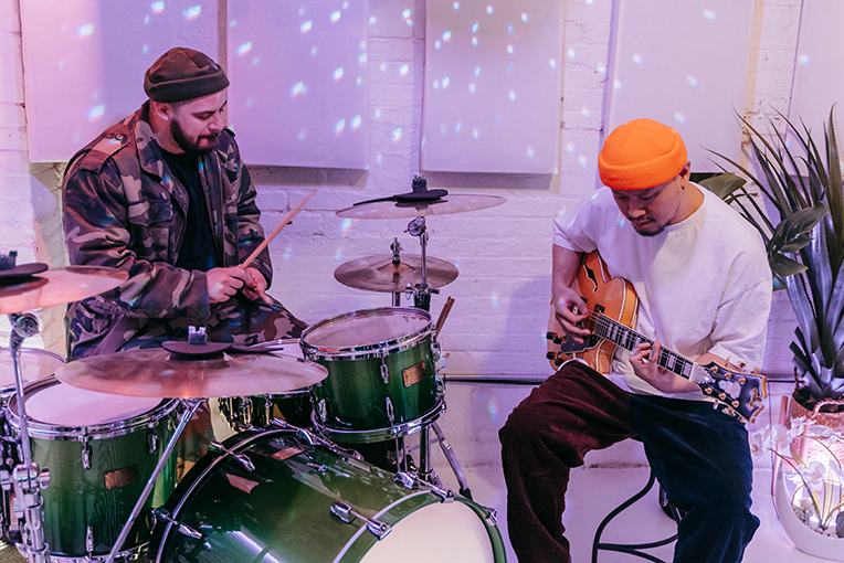 drummer and guitarist playing a jam