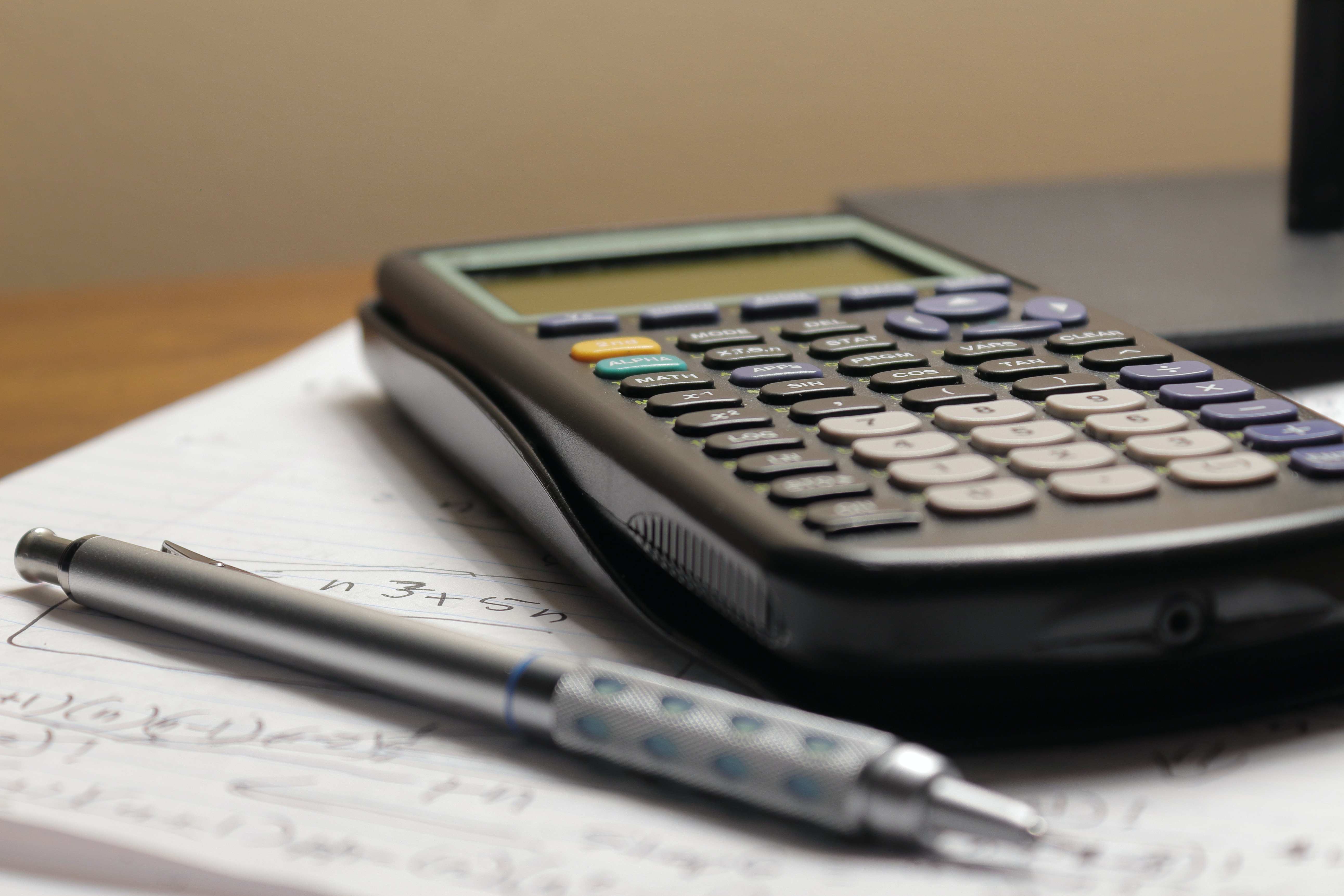 Close up of calculator and pencil